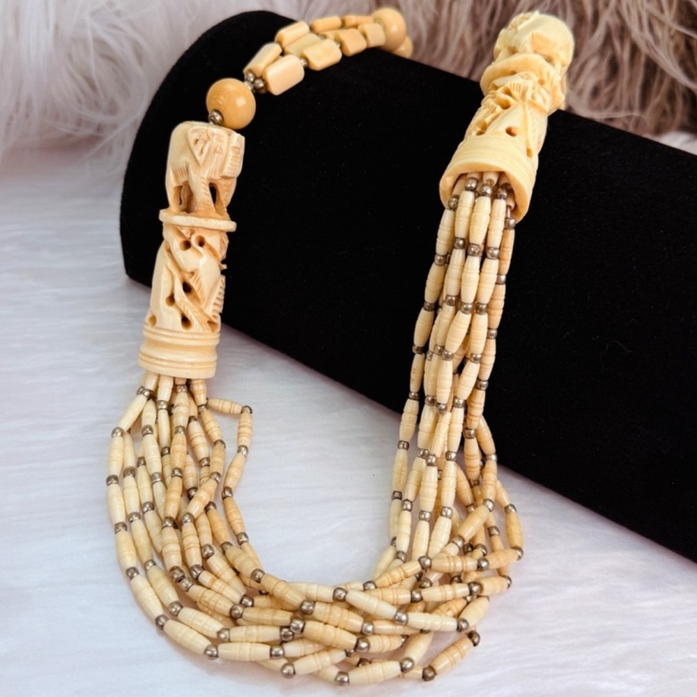 Vintage 10 strand, weighted Cream Beaded tribal carved elephant necklace